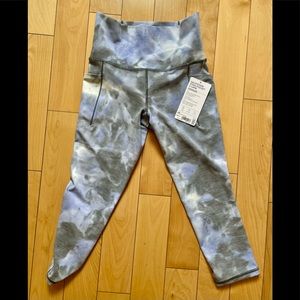 Brand new with tag: multi-color Athleta Salution Capri with side pocket. Size xs